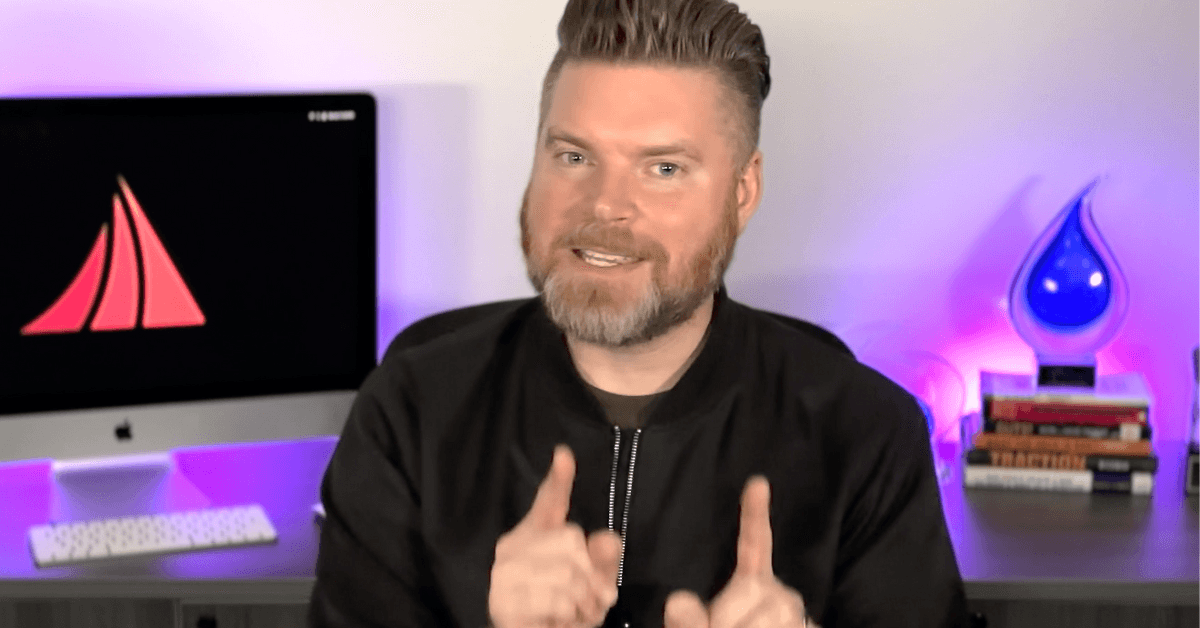 Mediaura's CEO, Andrew Aebersold, sits in front of a desk, explaining how Meta ads is changing your campaigns via AI without your knowledge.