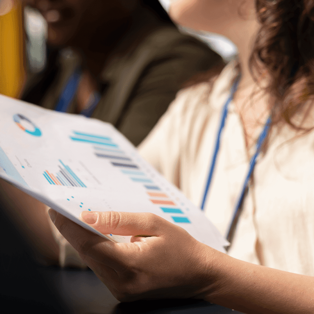 A woman holding a report about Mediaura's digital marketing strategy.